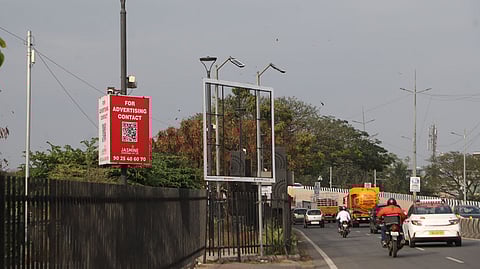 After flyovers, illegal hoardings have started popping up along the banks of the Valankulam lake in the city, on the Sungam Bypass.