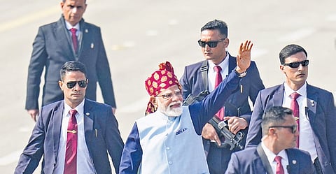 With maroon turban, Modi maintains headgear custom