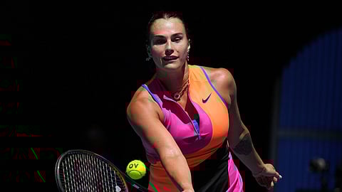 Aryna Sabalenka of Belarus plays a forehand return to Iva Jovic of the U.S. during their quarterfinal match at the Australian Open tennis championship in Melbourne, Australia, Tuesday, Jan. 27, 2026.