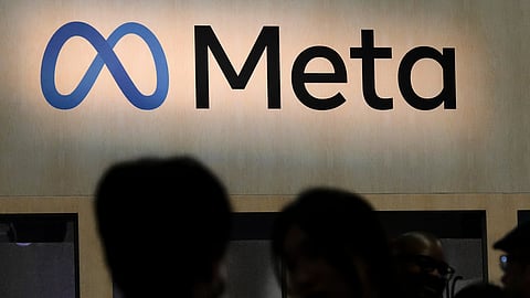 FILE - Attendees visit the Meta booth at the Game Developers Conference 2023 in San Francisco on March 22, 2023