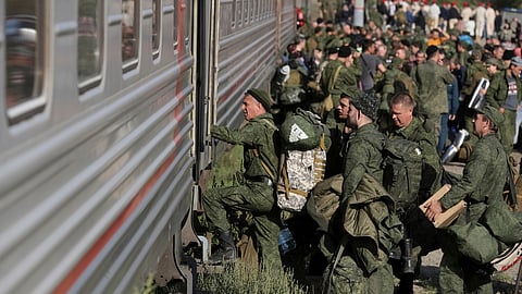 FILE - Russian recruits take a train at a railway station in Prudboi in the Volgograd region of Russia, Sept. 29, 2022.