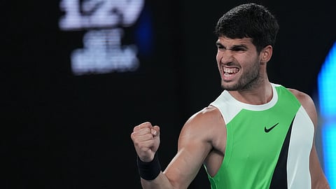 Carlos Alcaraz of Spain reacts during his quarterfinal match against Alex de Minaur of Australia during their quarterfinal match at the Australian Open tennis championship in Melbourne.