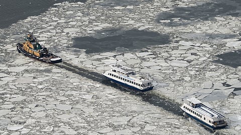 New York Waterway ferries move as ice floats on the Hudson River seen from the Edge sky deck at Hudson Yards, Tuesday, Jan. 27, 2026, in New York.