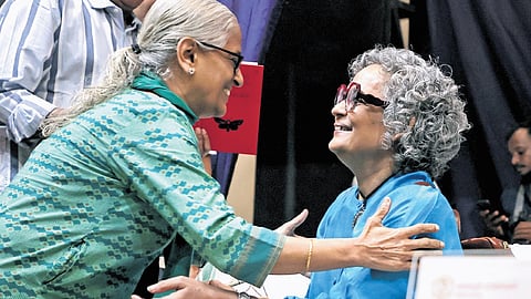 A woman embraces writer Arundhati Roy, the recipient of the Malayattoor Literary Award, in Thiruvananthapuram on Wednesday.