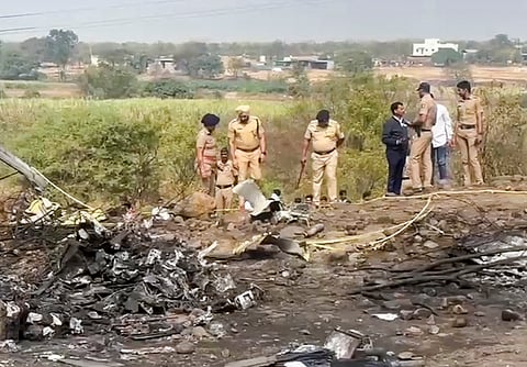 Police officials at the spot after an aircraft carrying Maharashtra Deputy Chief Minister Ajit Pawar crashed during landing, near Baramati in Pune district, Maharashtra, Wednesday, Jan. 28, 2026.
