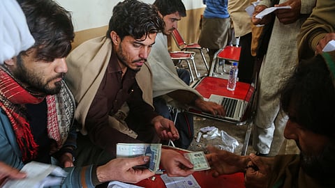 Government workers get information from people, who fled from Tirah, a town in the Khyber Pakhtunkhwa province, amid uncertainty over a military operation against the Pakistani Taliban, at a registration center in Bara, a town of Pakistan's northwestern Khyber district.