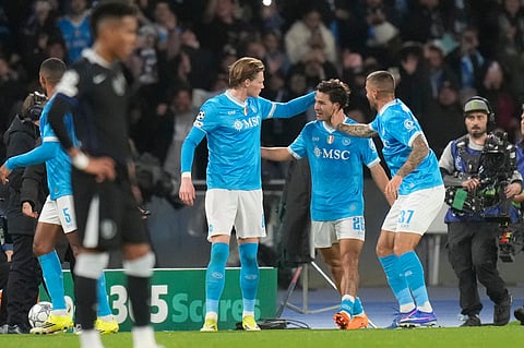 Napoli's Antonio Vergara, center, celebrates with his teammate Scott McTominay, left, and Leonardo Spinazzola after scoring his side's first goal during a Champions League opening phase soccer match between Napoli and Chelsea on January.28, 2026.