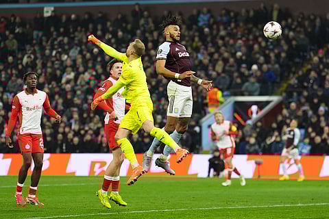 Aston Villa's Tyrone Mings, top, scores during the Europa League opening phase soccer match between Aston Villa and RB Salzburg in Birmingham, England, Thursday Jan. 29, 2026.