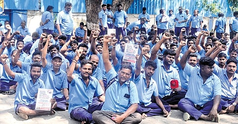 Temporary employees stage a protest near the headquarters of Metro Water at Chintadripet on Friday seeking permanent jobs
