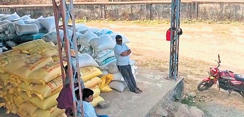 Unlifted paddy bags lying at a mandi in Malkangiri district.