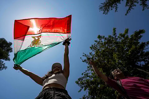 Protesters shout slogans against Supreme Leader Ayatollah Ali Khamenei during a rally in support of anti-government protests in Iran