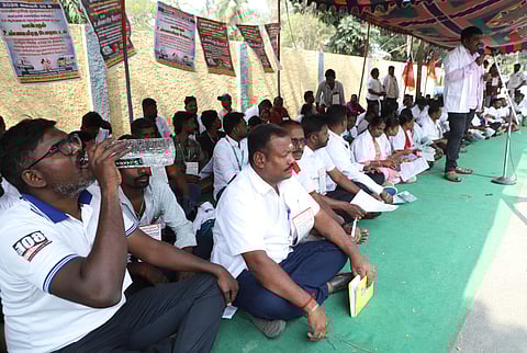 The group of employees working with the 108 ambulance services held a hunger strike at Tatabad in Coimbatore on Friday