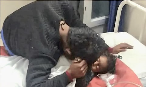 A photograph of a father crying over the body of her three-year-old daughter, who was killed in a leopard attack, went viral and ignited a fierce debate over the viability of life in the hills.