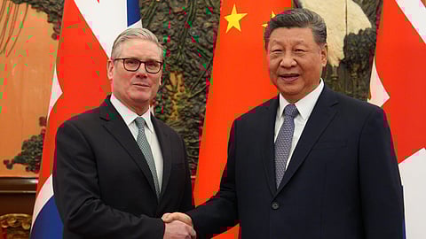 British Prime Minister Keir Starmer, left, shakes hands with Chinese President Xi Jinping ahead of a meeting in Beijing Thursday, Jan. 29, 2026.