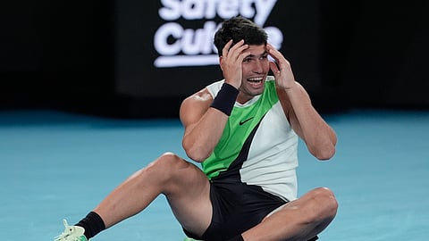 Carlos Alcaraz of Spain celebrates after defeating Novak Djokovic of Serbia in the men's singles final at the Australian Open tennis championship in Melbourne, Australia, Sunday, Feb. 1, 2026.