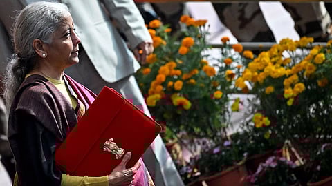 Finance minister Nirmala Sitharaman leaves the ministry office to present the annual budget to the parliament at the Kartavya Bhawan in New Delhi on Sunday