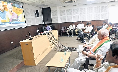 BJP leaders B S Yediyurappa, R Ashoka, Chalavadi Narayanaswamy and others watch Finance Minister Nirmala Sitharaman present the Union Budget, at the BJP office in Bengaluru on Sunday.