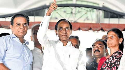 BRS chief K Chandrasekhar Rao greets his party workers from the balcony of his Nandinagar residence after appearing before the SIT, in Hyderabad on Sunday