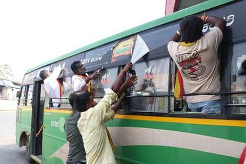 The activists of Karnataka Rakshana Vedike Simhasene seen removing surrogate gutka advertisements pasted on KSRTC buses at KSRTC Bus Stand in Shivamogga.