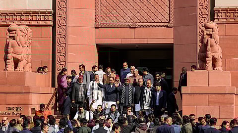 Opposition MPs protest at the Parliament complex against the suspension of eight MPs from the Lok Sabha and the India-US trade agreement during the Budget session of Parliament, in New Delhi, Tuesday, Feb. 3, 2026.