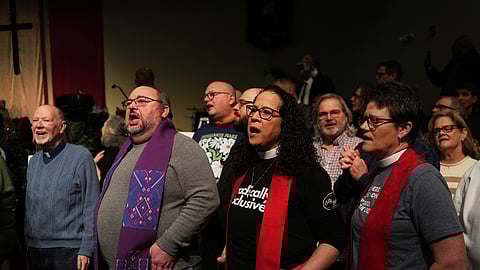 Faith leaders sing together as a sign of support for Haitian migrants fearing the end of their Temporary Protected Status in the U.S., at an event held at St. John Missionary Baptist Church in Springfield, Ohio on Monday, Feb. 2, 2026.
