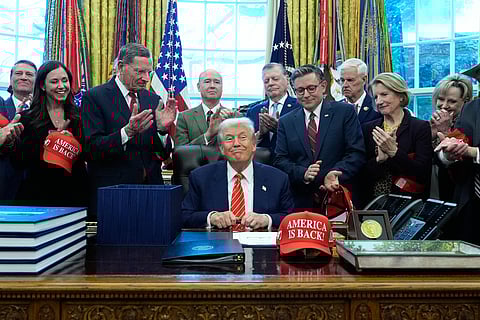 President Donald Trump smiles after signing a spending bill that ends a partial shutdown of the federal government in the Oval Office of the White House, Tuesday, Feb. 3, 2026, in Washington.