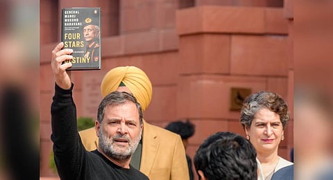Leader of Opposition Rahul Gandhi holding up Army chief MM Naravane's 'unreleased memoir' at the Parliament complex.