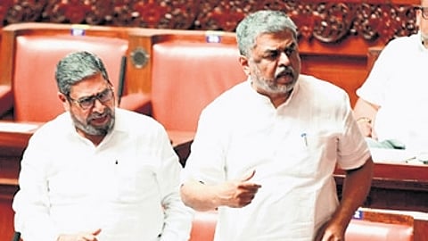 Congress MLCs BK Hariprasad and Naseer Ahmed during the Council Session at Vidhana Soudha, in Bengaluru on Wednesday.