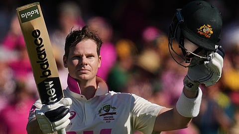 Steve Smith celebrates after scoring a century during play on day three of the fifth and final Ashes Test between England and Australia in Sydney.