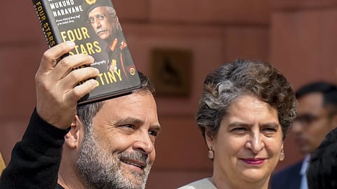 Rahul Gandhi shows a copy of the unpublished memoir of former Army chief M M Naravane on Wednesday