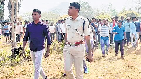 Police officials inspect the crime scene in MV-16 village of Malkangiri
