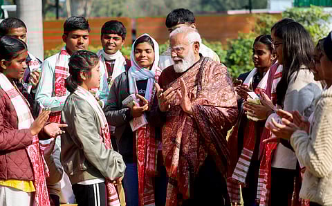 In this image released on Feb. 6, 2026, Prime Minister Narendra Modi interacts with students during the ninth edition of 'Pariksha Pe Charcha 2026 with PM' at his residence, in New Delhi.
