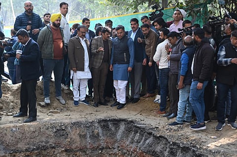 Delhi PWD Minister Parvesh Verma visits the spot in Janakpuri where a biker fell to death in a pit last night, in New Delhi on Friday.