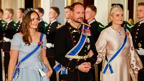 From left, Norway's Princess Ingrid Alexandra, left, Crown Prince Haakon and Crown Princess Mette-Marit on their way to a gala dinner at the Palace in Oslo, Tuesday, April 8, 2025.