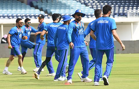 Rashid Khan (3rd from R) practices with his teammates at MA Chidambaram Stadium on Saturday