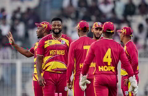 West Indies' Romario Shepherd, 2nd from left, celebrates with teammates after taking the wicket of Scotland's Brandon McMullen during the T20 World Cup match between West Indies and Scotland, at the Eden Gardens, in Kolkata. (Photo | PTI)