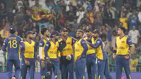 Sri Lanka's Wanindu Hasaranga, center, celebrates with teammates the wicket of Ireland's Curtis Campher during the T20 World Cup cricket match between Sri Lanka and Ireland in Colombo, Sri Lanka, Sunday, Feb. 8, 2026.