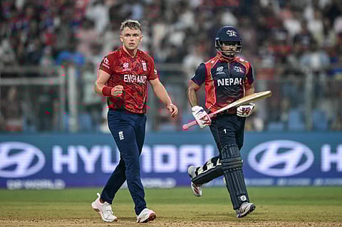 England's Sam Curran (L) reacts after the final ball on Sunday