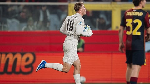 Højlund celebrates after scoring a penalty as Napoli won 3-2 at Genoa in Serie A on Saturday.