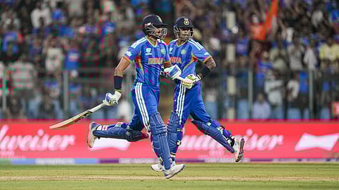 India's captain Suryakumar Yadav and teammate Axar Patel run between the wickets during the ICC Men's T20 World Cup 2026 cricket match between India and USA, at the Wankhede Stadium, in Mumbai, Saturday, Feb. 7, 2026.