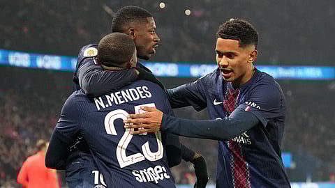 PSG's Ousmane Dembele, top left, celebrates with teammates after scoring the opening goal during the French League One soccer match between Paris Saint-Germain and Marseille in Paris, Sunday, Feb. 8, 2026.