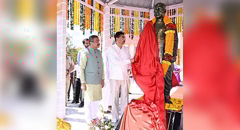 Odisha Governor Hari Babu Kambhampati unveiling the statue of Pabitra Mohan Pradhan. Union Minister Dharmendra Pradhan is also seen.