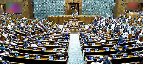 Opposition MPs create a ruckus in Lok Sabha during the Budget Session, in New Delhi on Monday.