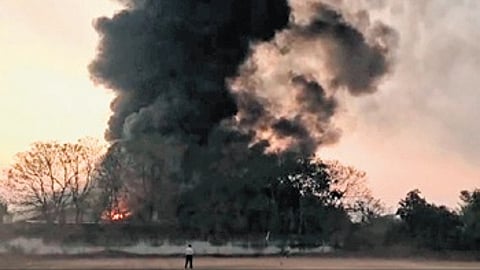 Thick smoke billowing out of the factory.