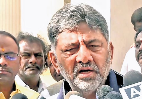 Deputy Chief Minister DK Shivakumar addresses the media before leaving
for New Delhi, in Bengaluru on Tuesday.