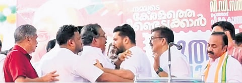 Congress workers urging MP Shafi Parambil to stay during the party programme