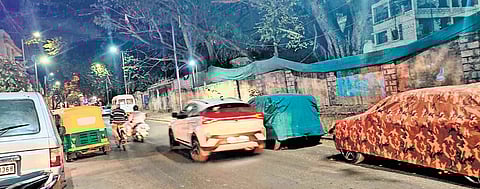 Vehicles parked along Kamaraj Road after No Parking boards were removed