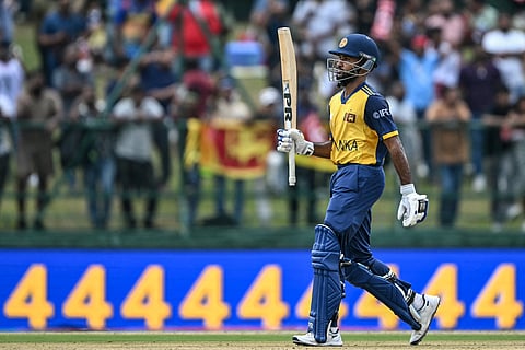Sri Lanka's Pavan Rathnayake celebrates after scoring a half-century (50 runs) during the 2026 ICC Men's T20 Cricket World Cup group stage match between Sri Lanka and Oman.
