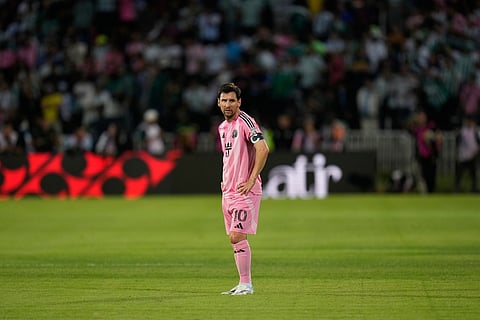 Inter Miami's Lionel Messi stands on the pitch during an international friendly soccer match.