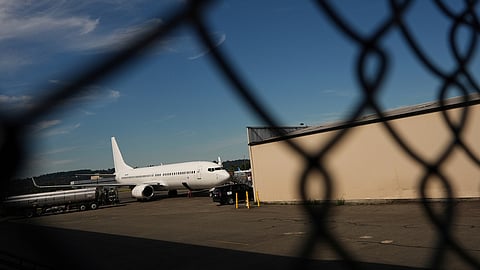 FILE - A U.S. Immigration and Customs Enforcement flight operates out of King County International Airport-Boeing Field, Aug. 23, 2025, in Seattle.